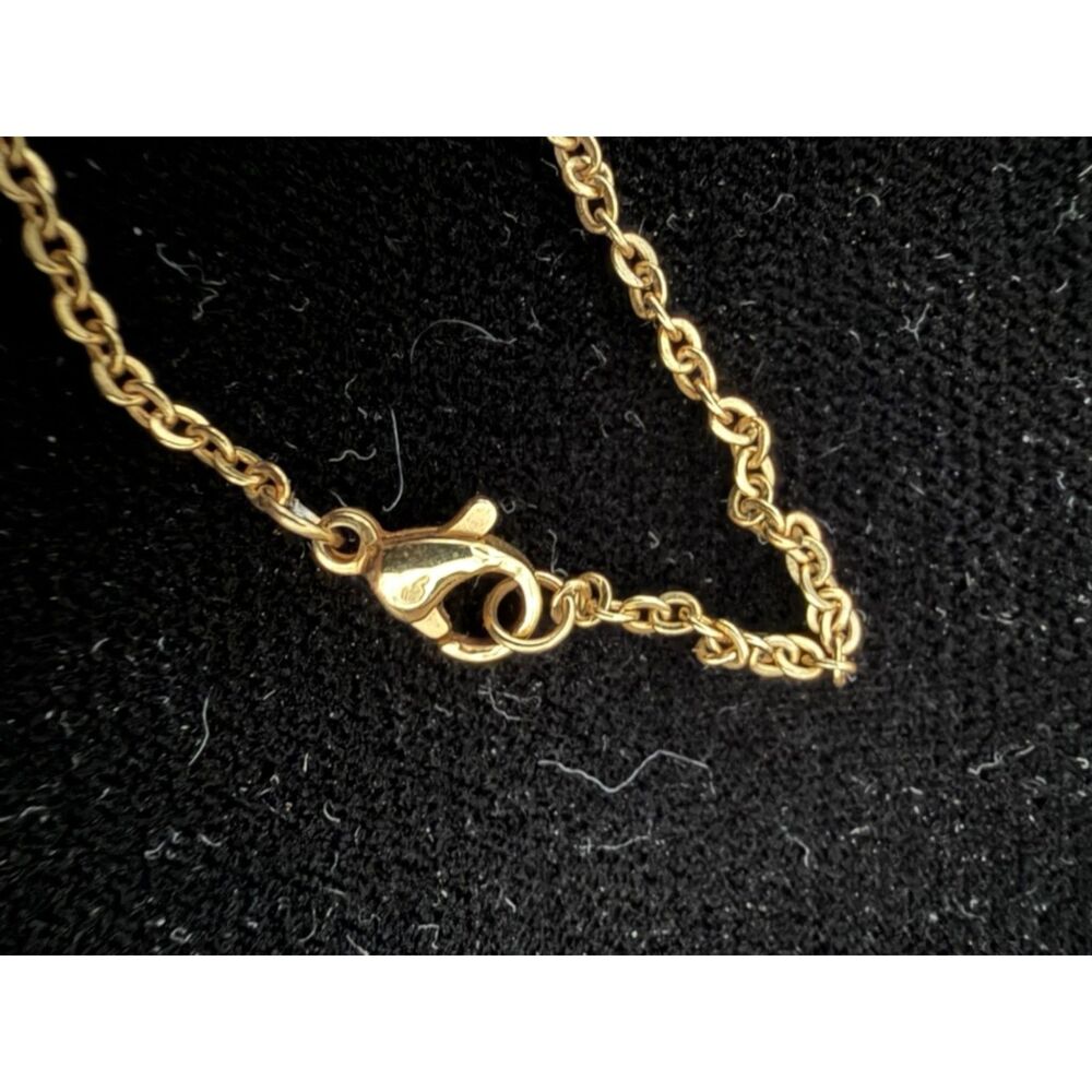 Channel symbol over mother of pearl inlay pendant on gold toned chain - Picture 7 of 10